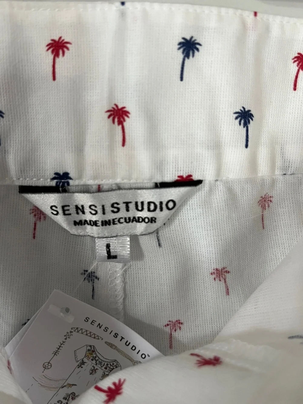 White Cropped Pants with Red & Navy Palm Print w/Ruffled Ties on each leg.  Sz L
